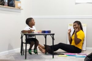 woman in black dress sitting on chair